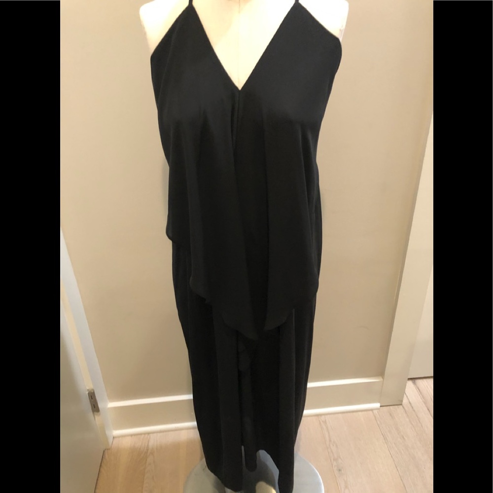 Olivaceous draped black dress.